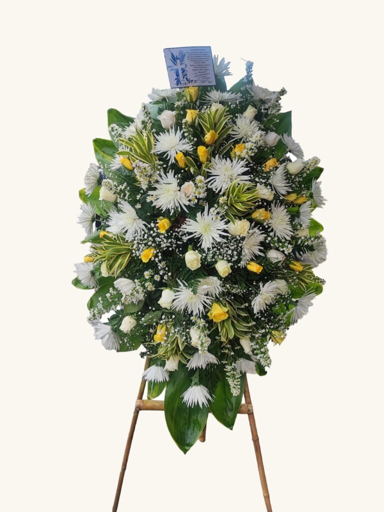 Ramo fúnebre de rosas blancas y amarillas para condolencias en Pereira